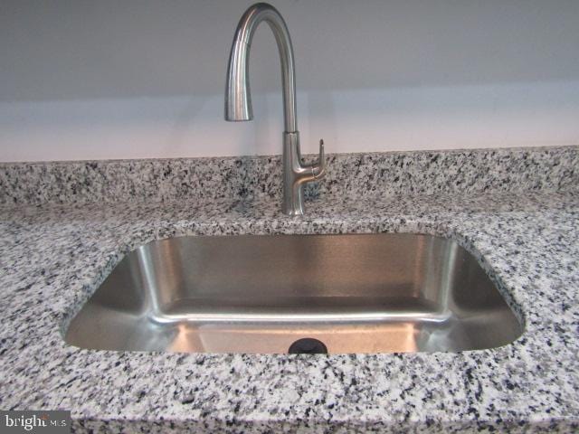 16 Gilmor St, Baltimore, MD 21223 - kitchen view of a sink and light stone counters