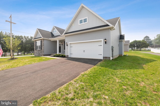 138 Ledger Dr Unit 76, Hanover, PA 17331 - view of front of property featuring board and batten siding, driveway, a front yard, and a garage