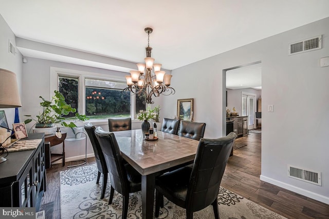 8825 Briarcroft Ln, Laurel, MD 20708 - dining room featuring a chandelier and dark wood-type flooring