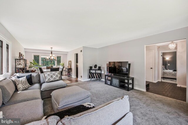 8825 Briarcroft Ln, Laurel, MD 20708 - living room with a chandelier and dark carpet