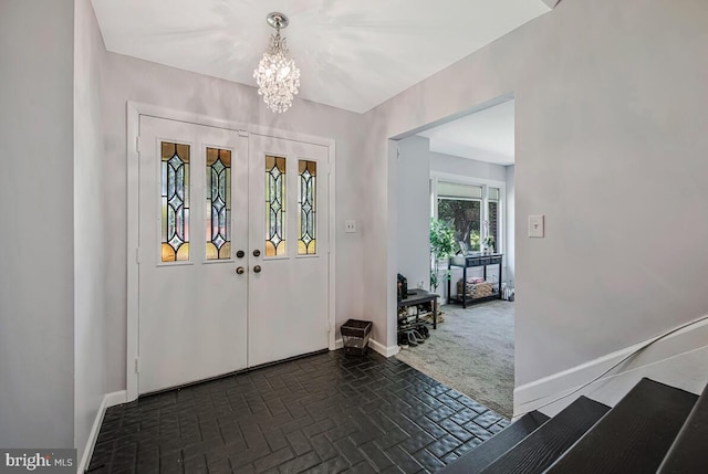 8825 Briarcroft Ln, Laurel, MD 20708 - entryway with a chandelier and brick patterned flooring
