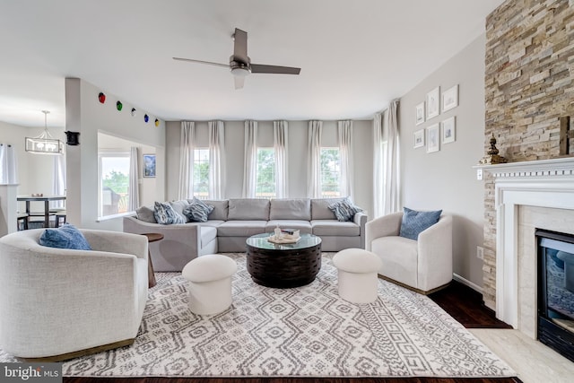 43865 Laurel Ridge Dr, Ashburn, VA 20147 - living room with a ceiling fan, wood finished floors, and a fireplace with flush hearth