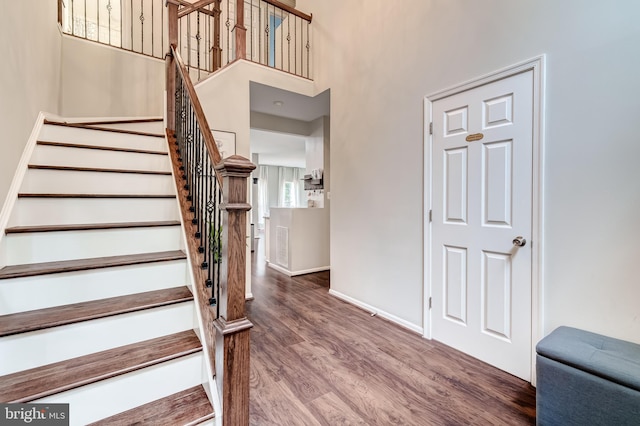 43865 Laurel Ridge Dr, Ashburn, VA 20147 - stairs featuring wood finished floors and a towering ceiling