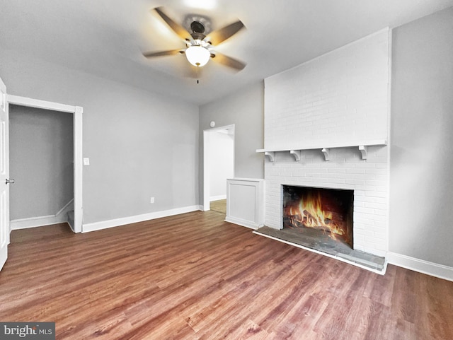 534 Columbia Ave, Millville, NJ 08332 - unfurnished living room featuring ceiling fan, wood finished floors, and a fireplace
