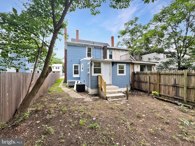534 Columbia Ave, Millville, NJ 08332 - back of house featuring a fenced backyard, a chimney, and a balcony
