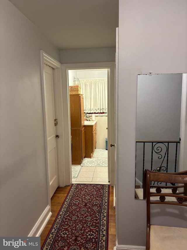823 Church Ln, Lansdowne, PA 19050 - hallway featuring light wood-type flooring and baseboards