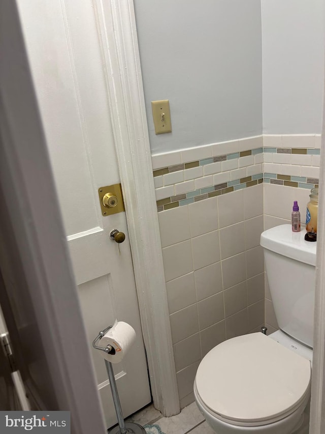 823 Church Ln, Lansdowne, PA 19050 - bathroom featuring tile walls, tile patterned floors, and wainscoting