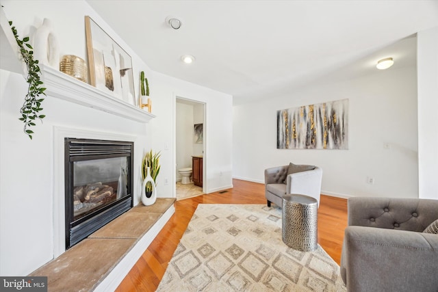 2121 Carpenter St Unit 2, Philadelphia, PA 19146 - living area featuring a glass covered fireplace, wood finished floors, and recessed lighting