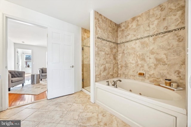 2121 Carpenter St Unit 2, Philadelphia, PA 19146 - bathroom with a tub with jets, a stall shower, and tile patterned floors