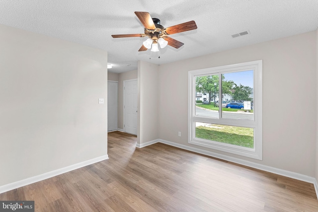104 Drury Cir, Sterling, VA 20164 - empty room with light wood finished floors, a ceiling fan, and a textured ceiling