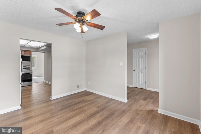 104 Drury Cir, Sterling, VA 20164 - spare room with light wood finished floors, ceiling fan, and a textured ceiling