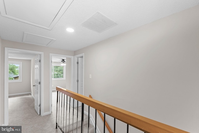 104 Drury Cir, Sterling, VA 20164 - hallway featuring an upstairs landing, light carpet, attic access, a textured ceiling, and recessed lighting