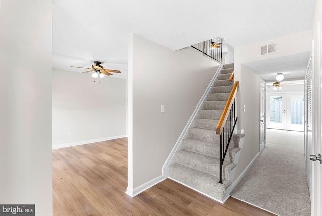 104 Drury Cir, Sterling, VA 20164 - stairs with ceiling fan, wood finished floors, a textured ceiling, and french doors