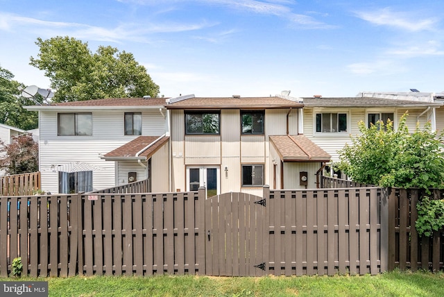 104 Drury Cir, Sterling, VA 20164 - rear view of house with a gate and a shingled roof