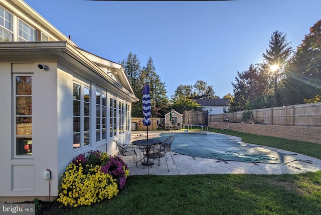 1006 Kimberwicke Rd, Mclean, VA 22102 - view of swimming pool with a trampoline, a patio area, and a fenced backyard