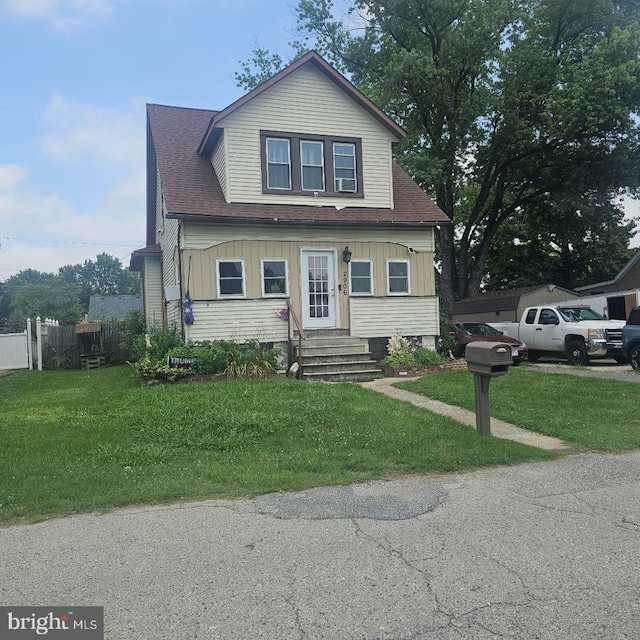 2906 Ohio Ave, Halethorpe, MD 21227 - bungalow-style house featuring entry steps, a front yard, and roof with shingles