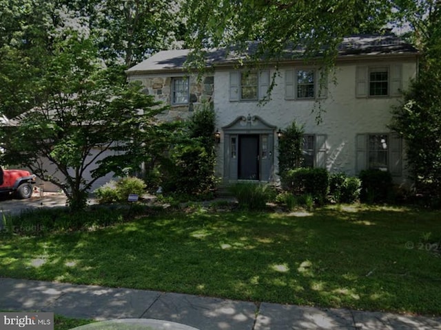 111 Cobblestone Ln, Dover, DE 19904 - colonial inspired home with a front lawn and stucco siding