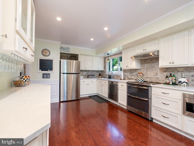 220 Rabbitt Rd, Gaithersburg, MD 20878 - kitchen featuring stainless steel appliances, ornamental molding, under cabinet range hood, light countertops, and white cabinets