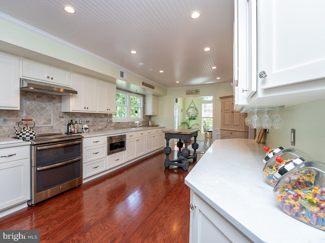 220 Rabbitt Rd, Gaithersburg, MD 20878 - kitchen with double oven range, under cabinet range hood, recessed lighting, light countertops, and white cabinets