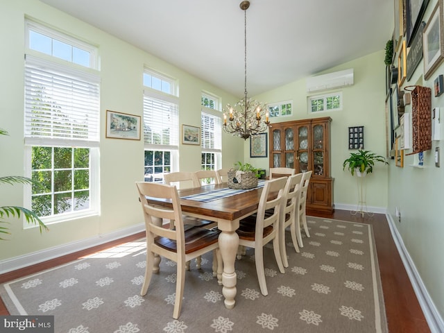 220 Rabbitt Rd, Gaithersburg, MD 20878 - dining area with wood finished floors, a wall mounted AC, a chandelier, and vaulted ceiling