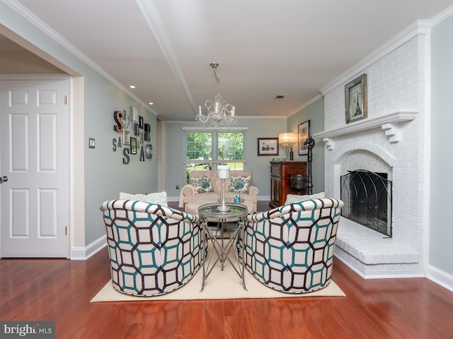 220 Rabbitt Rd, Gaithersburg, MD 20878 - living area featuring wood finished floors, a chandelier, a fireplace, crown molding, and recessed lighting