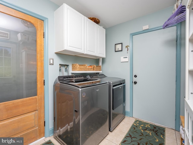 220 Rabbitt Rd, Gaithersburg, MD 20878 - laundry room with separate washer and dryer, cabinet space, and light tile patterned flooring