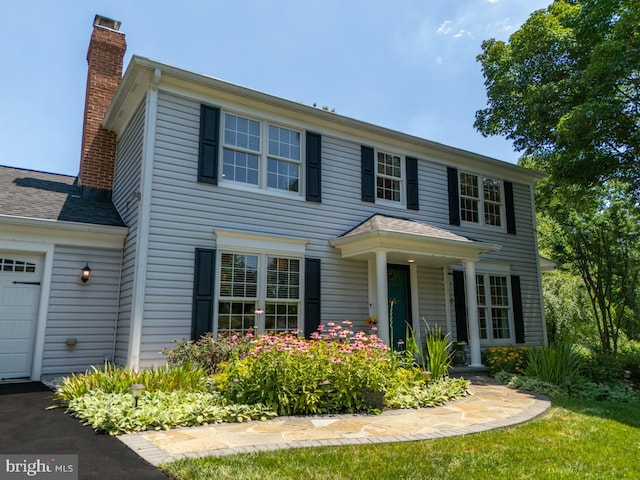 220 Rabbitt Rd, Gaithersburg, MD 20878 - view of front of property with a chimney and an attached garage