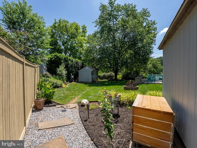 220 Rabbitt Rd, Gaithersburg, MD 20878 - view of yard with an outdoor fire pit and a shed