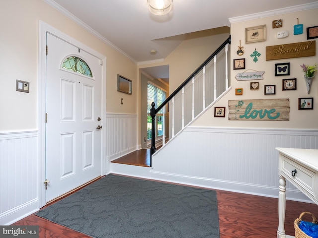 220 Rabbitt Rd, Gaithersburg, MD 20878 - entrance foyer with a wainscoted wall, wood finished floors, stairway, ornamental molding, and a decorative wall