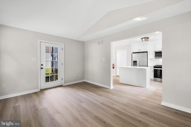 5 W Atlantic Ave, Somerdale, NJ 08083 - unfurnished living room featuring lofted ceiling and light wood-type flooring
