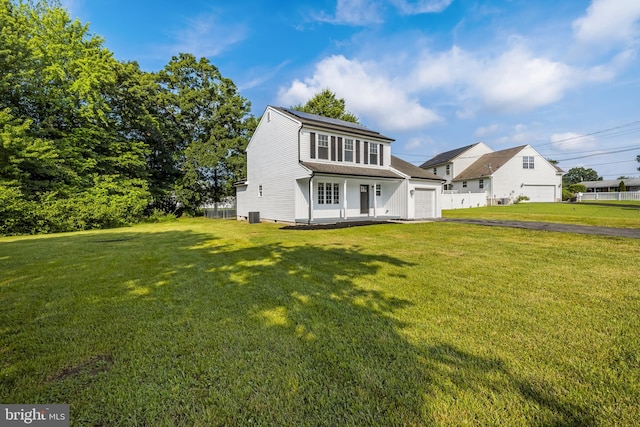 5 W Atlantic Ave, Somerdale, NJ 08083 - view of front of home featuring a garage, asphalt driveway, a front yard, and a shingled roof