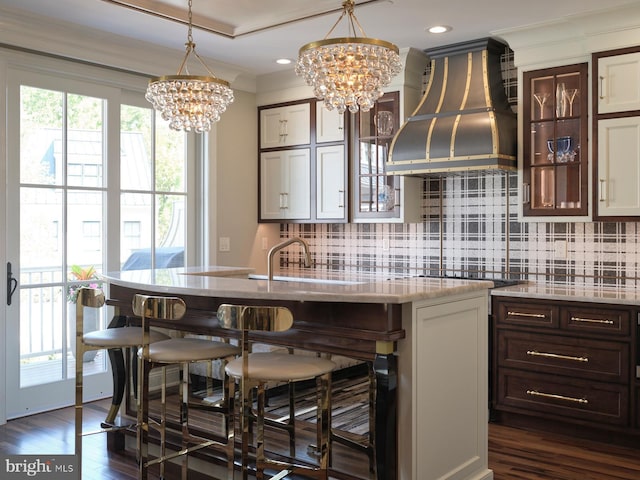 44 W Mechanic St, New Hope, PA 18938 - kitchen featuring island exhaust hood, a chandelier, a kitchen breakfast bar, backsplash, and crown molding