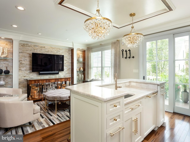 44 W Mechanic St, New Hope, PA 18938 - kitchen with open floor plan, a chandelier, light stone counters, hanging light fixtures, and ornamental molding