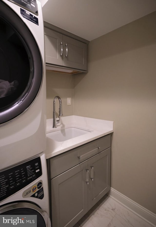 44 W Mechanic St, New Hope, PA 18938 - laundry room with cabinet space, stacked washer and clothes dryer, and light marble finish floors