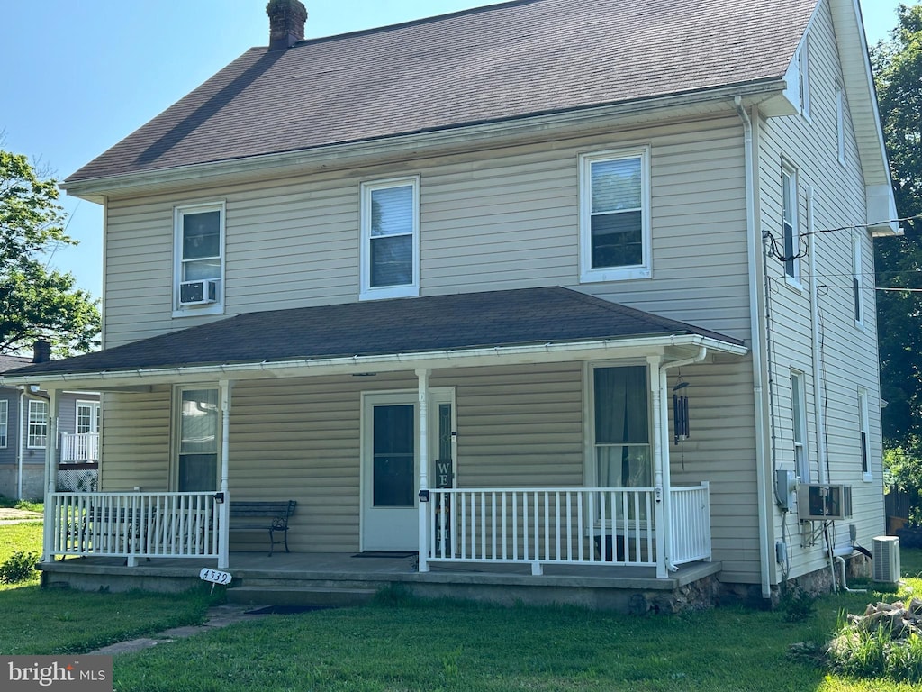 4539 Salem Bottom Rd, Westminster, MD 21157 - view of front facade featuring covered porch, a chimney, a front yard, and cooling unit