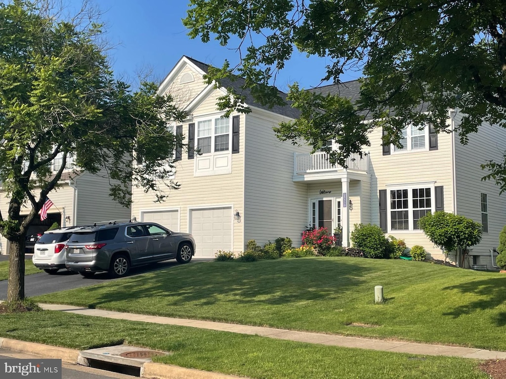 25530 Chilmark Dr, Chantilly, VA 20152 - view of front of home with a balcony, an attached garage, driveway, and a front lawn