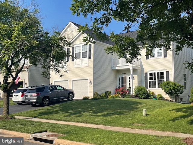 25530 Chilmark Dr, Chantilly, VA 20152 - view of front of home with a balcony, an attached garage, driveway, and a front lawn