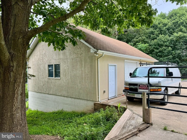 11608 Leesburg Pike, Herndon, VA 20170 - view of property exterior with roof with shingles, an outbuilding, and a garage