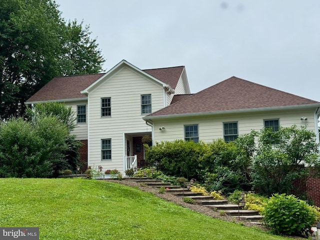11608 Leesburg Pike, Herndon, VA 20170 - back of property featuring a lawn and roof with shingles