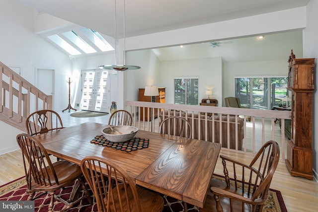 9 Sleepy Hollow Ln, West Windsor, NJ 08550 - dining area with vaulted ceiling, a skylight, and light wood-style flooring
