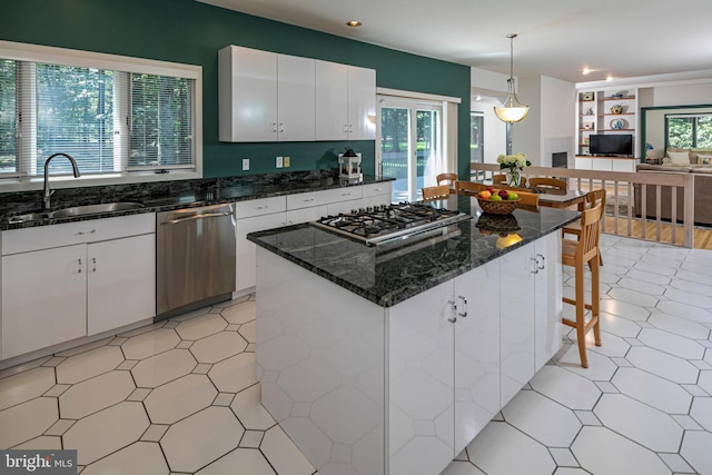 9 Sleepy Hollow Ln, West Windsor, NJ 08550 - kitchen featuring appliances with stainless steel finishes, white cabinetry, a breakfast bar, dark stone counters, and recessed lighting