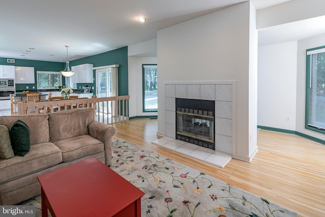 9 Sleepy Hollow Ln, West Windsor, NJ 08550 - living area featuring light wood-style floors, a fireplace, and recessed lighting