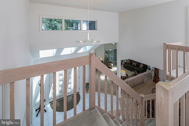 9 Sleepy Hollow Ln, West Windsor, NJ 08550 - stairs featuring tile patterned floors and a towering ceiling