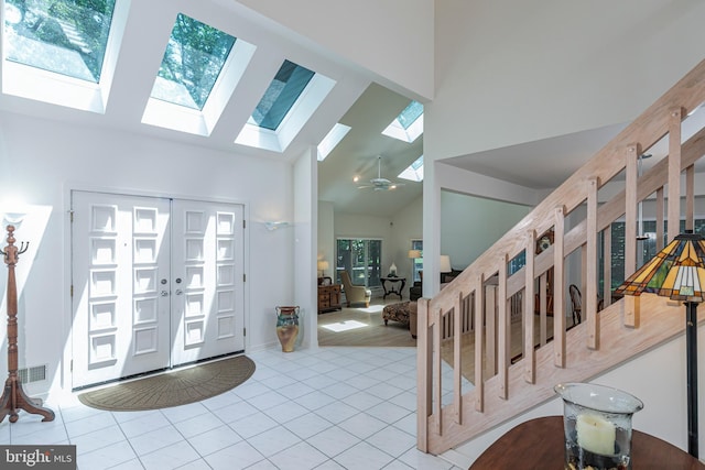 9 Sleepy Hollow Ln, West Windsor, NJ 08550 - foyer with a skylight, high vaulted ceiling, and tile patterned floors