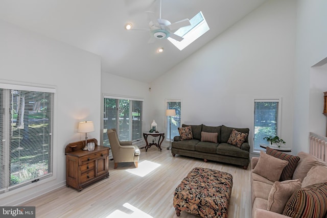 9 Sleepy Hollow Ln, West Windsor, NJ 08550 - living area featuring a skylight, high vaulted ceiling, ceiling fan, light wood finished floors, and recessed lighting