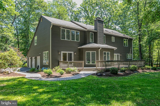 9 Sleepy Hollow Ln, West Windsor, NJ 08550 - rear view of property with a garage, a chimney, a wooden deck, a lawn, and asphalt driveway