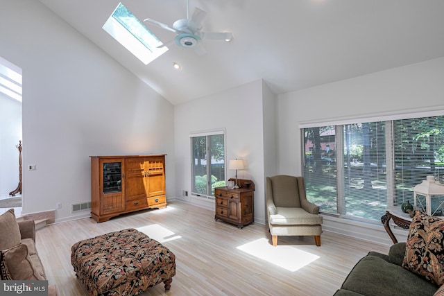 9 Sleepy Hollow Ln, West Windsor, NJ 08550 - living area with high vaulted ceiling, ceiling fan, a skylight, and light wood-type flooring
