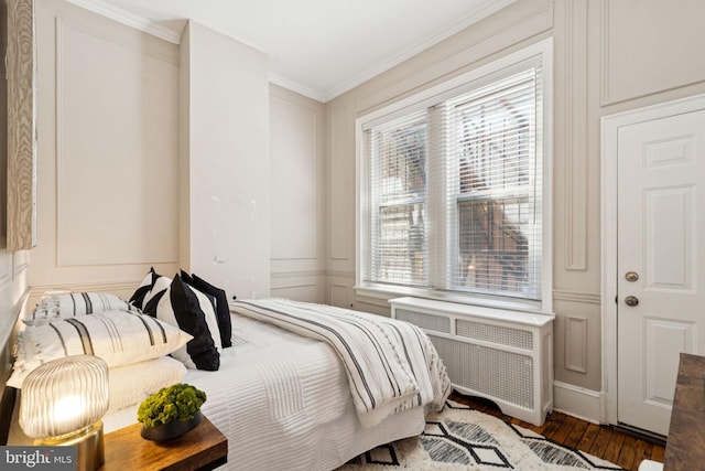 238 S 13th St Unit 1, Philadelphia, PA 19107 - bedroom featuring a decorative wall, radiator, wood finished floors, and ornamental molding