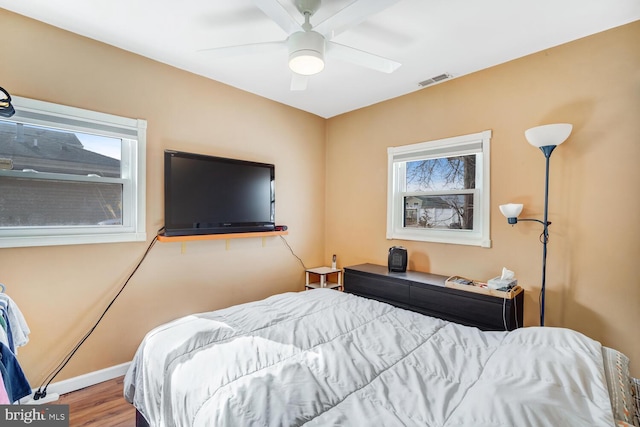 119 S Captains Dr, Little Egg Harbor Twp, NJ 08087 - bedroom with wood finished floors and a ceiling fan