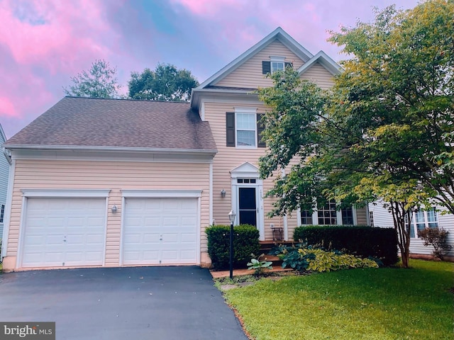 10051 Naughton Ct, Bristow, VA 20136 - traditional-style home with a garage, driveway, a front yard, and a shingled roof